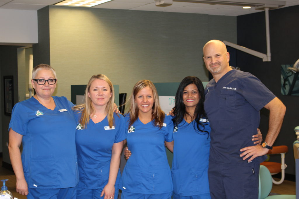 the ABC Dentistry staff smiling together