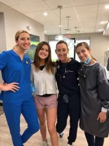 ABC Dentistry staff smiling with patient