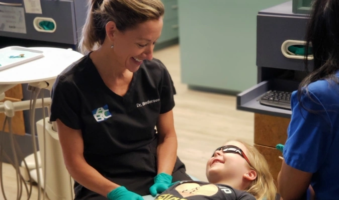 Doctor with pediatric patient at Schaumburg, IL dental practice